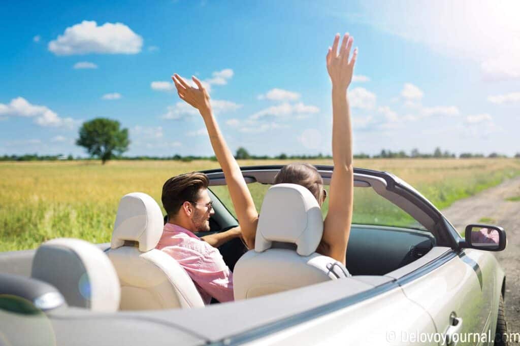 Couple driving convertable